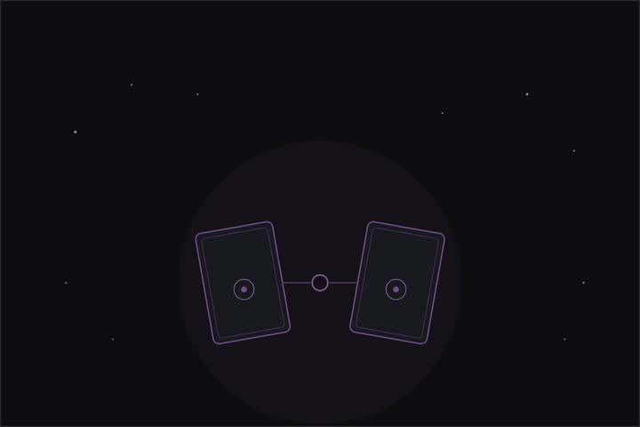 Relationship tarot spread: two tarot cards facing each other, joined at the connection, beneath a crescent moon