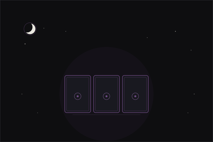 Three card tarot spread: three tarot cards in a row beneath a crescent moon